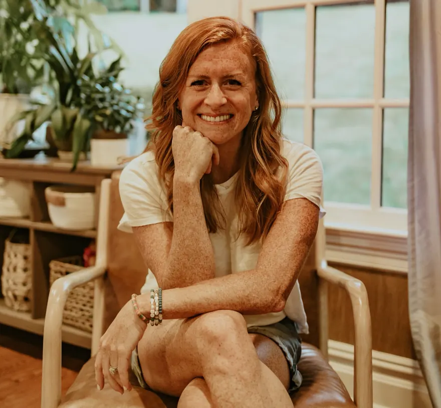 Kate Faraci sitting in a brown chair